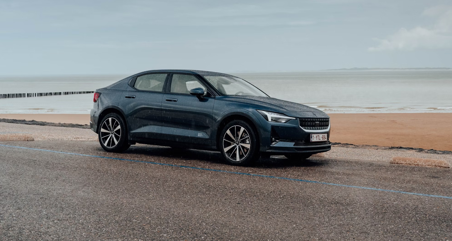 Image of a car driving on the beach.