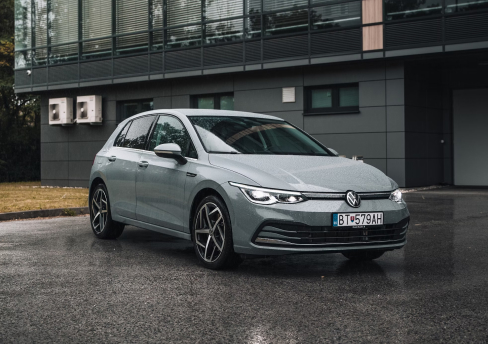 Image of a white parked car taken from the front.